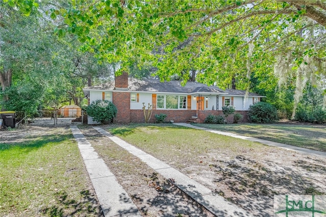 ranch-style home featuring a front yard