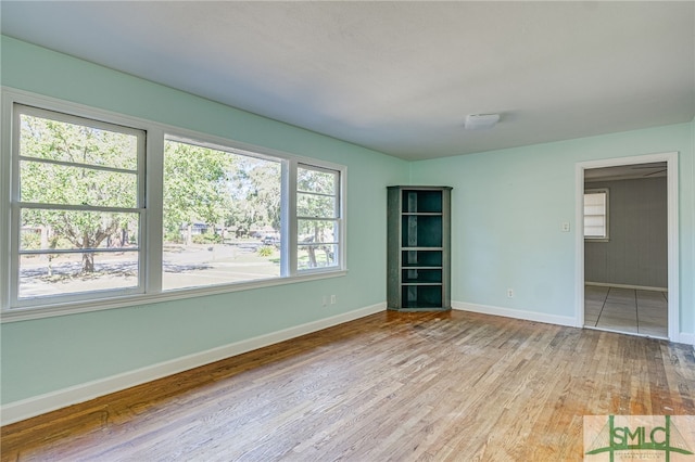 spare room featuring light hardwood / wood-style floors