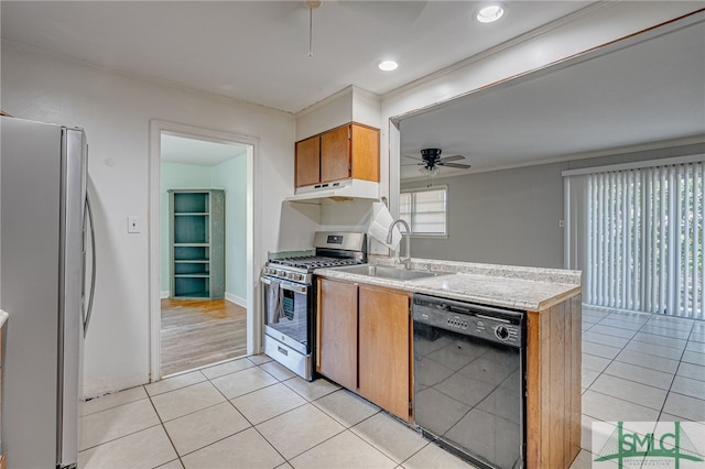 kitchen featuring ceiling fan, stainless steel appliances, sink, and light tile patterned floors