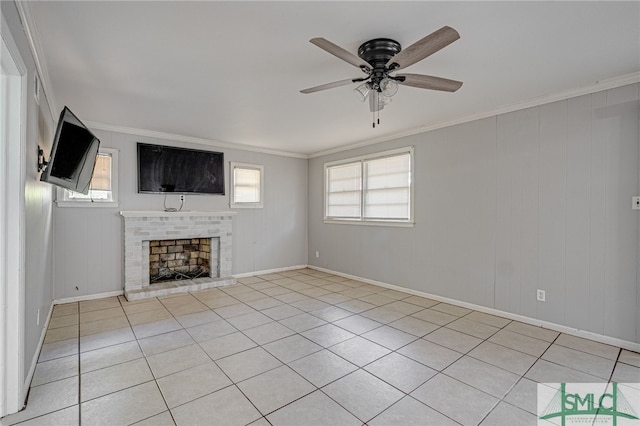 unfurnished living room featuring crown molding, ceiling fan, light tile patterned floors, and a brick fireplace