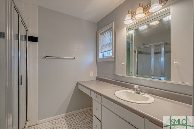 bathroom featuring vanity, tile patterned flooring, and an enclosed shower