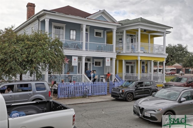 view of front of home featuring a porch and a balcony