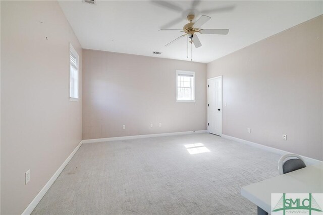 empty room with carpet and ceiling fan