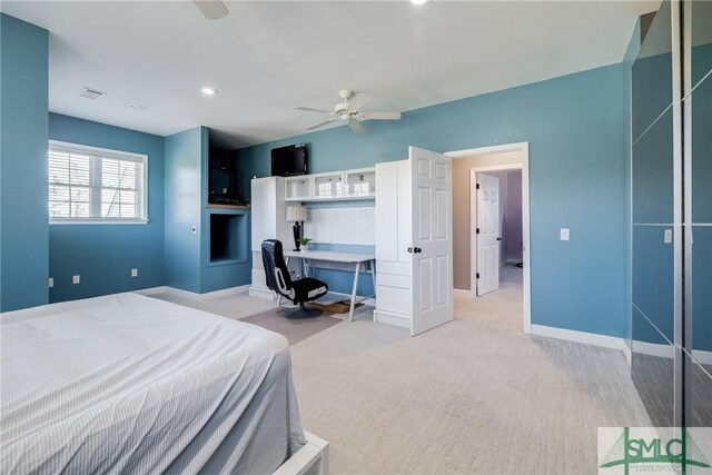 bedroom featuring light carpet and ceiling fan