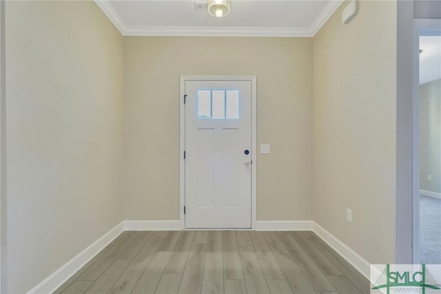 entryway with crown molding and light hardwood / wood-style flooring