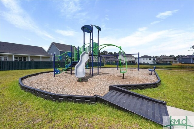 129 Hanover Pl, Richmond Hill, GA 31324 - community play area featuring a lawn, a residential view, and fence