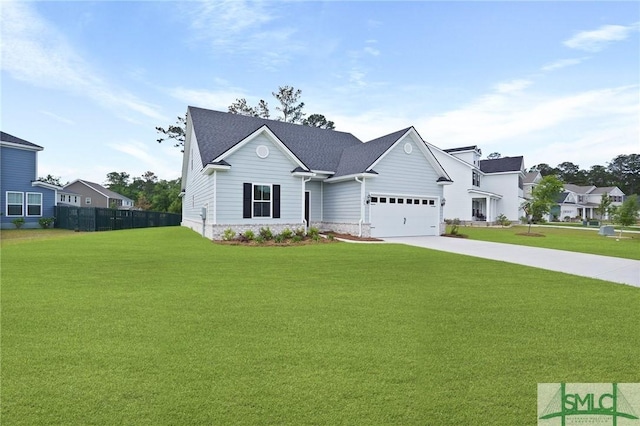129 Hanover Pl, Richmond Hill, GA 31324 - view of front of house featuring concrete driveway, a front lawn, a garage, and fence
