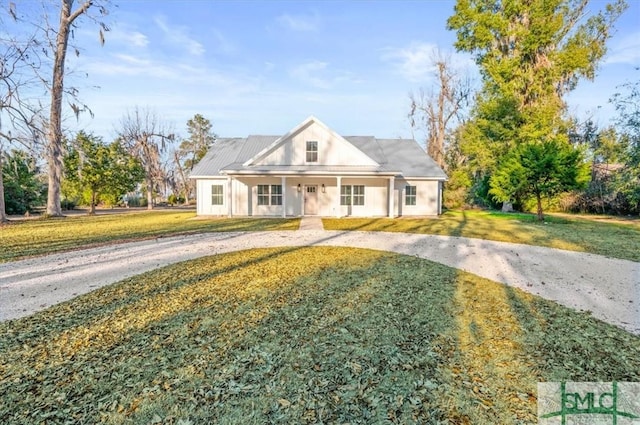 view of front of home featuring a front lawn and a porch