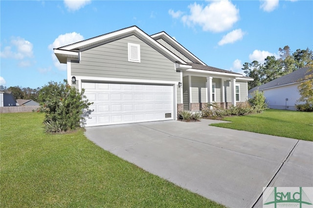 view of front of home featuring a garage and a front lawn