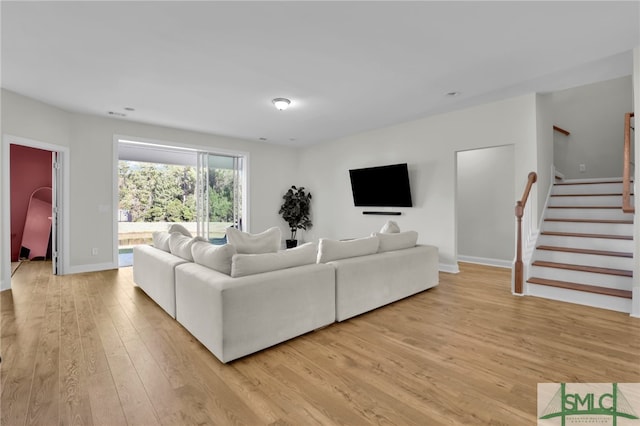 living room with light hardwood / wood-style floors