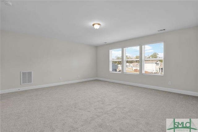 spare room featuring carpet floors