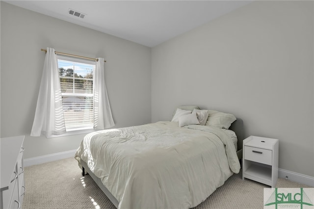 bedroom featuring light colored carpet