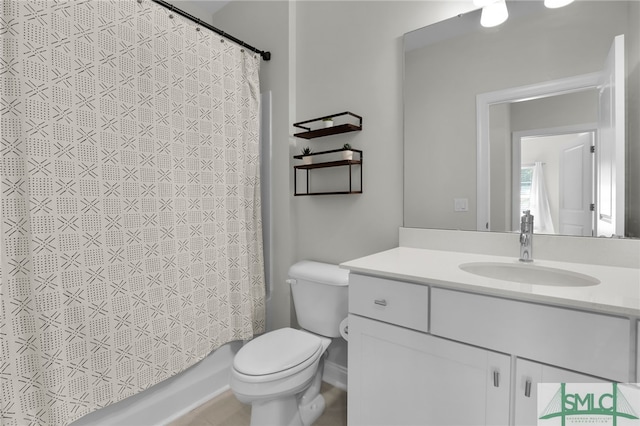 full bathroom featuring vanity, toilet, and shower / tub combo