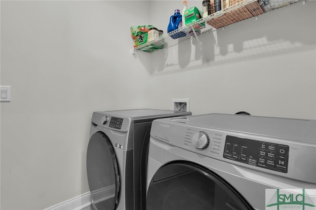 clothes washing area with independent washer and dryer