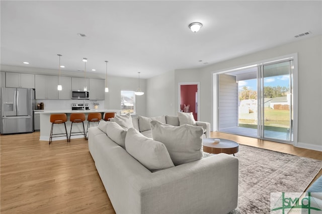 living room with light hardwood / wood-style floors