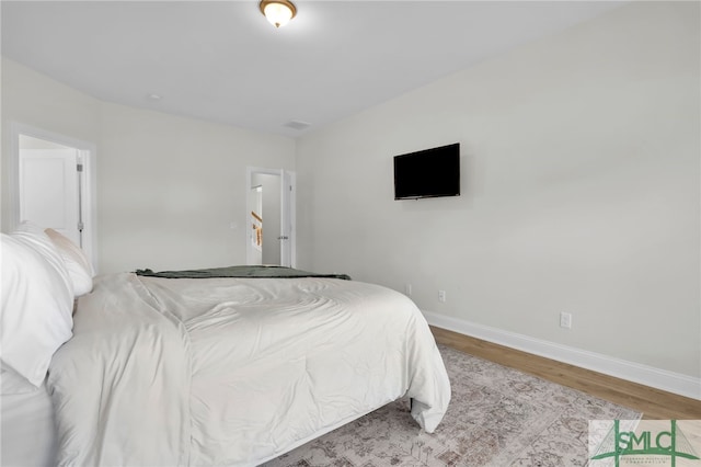 bedroom featuring wood-type flooring