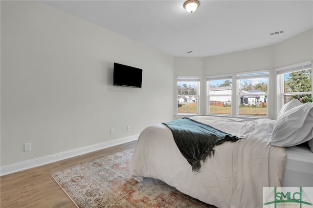 bedroom featuring wood-type flooring