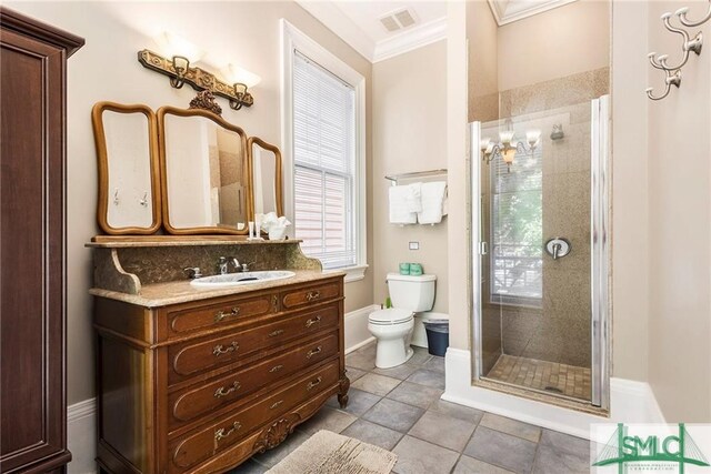 bathroom featuring walk in shower, tile patterned floors, toilet, crown molding, and vanity