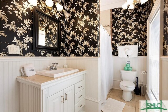 bathroom with tile patterned floors, toilet, and vanity