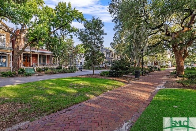 surrounding community featuring a lawn