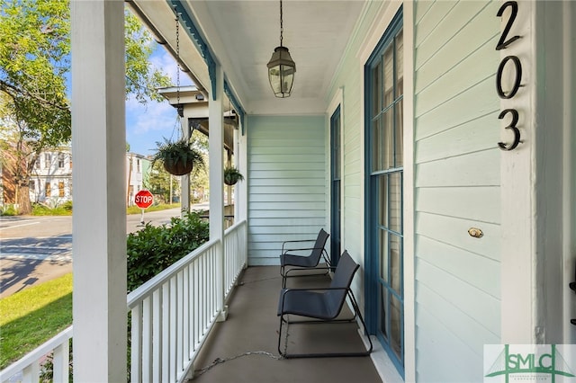 balcony featuring a porch