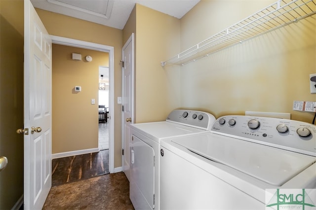 clothes washing area featuring washing machine and clothes dryer