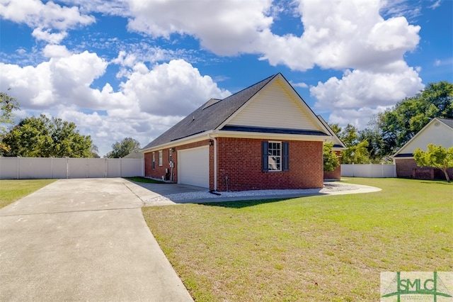 view of side of property with a yard