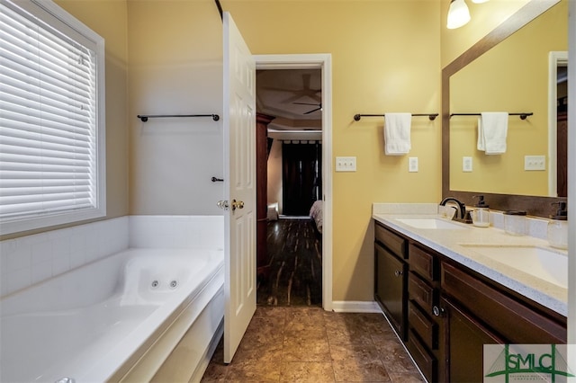 bathroom featuring vanity and a bathing tub