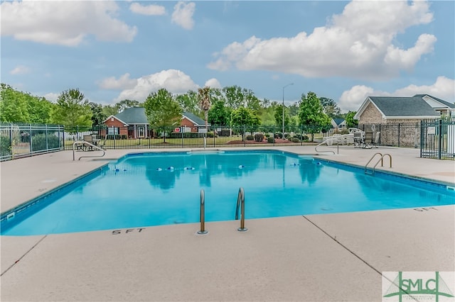 view of swimming pool with a patio