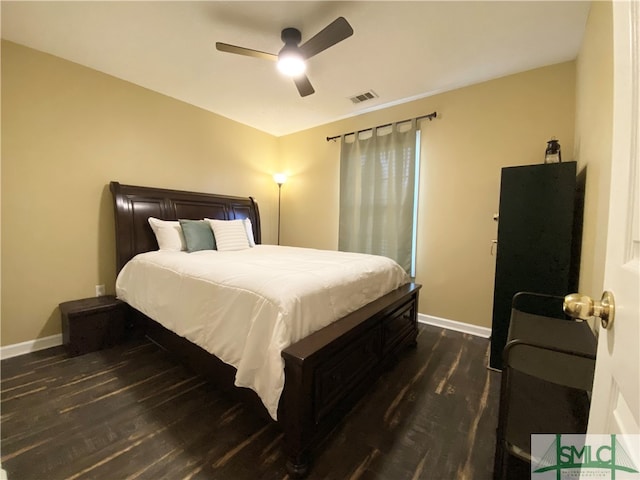 bedroom featuring ceiling fan and dark hardwood / wood-style floors