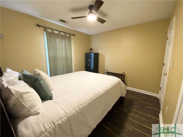 bedroom featuring ceiling fan and dark hardwood / wood-style flooring