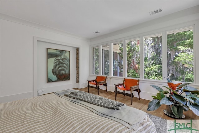 bedroom with light hardwood / wood-style floors