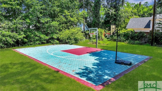 view of basketball court featuring a lawn