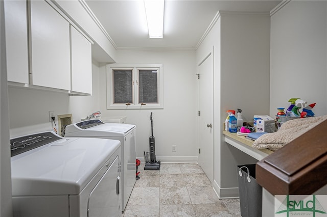 washroom with baseboards, separate washer and dryer, stone finish flooring, cabinet space, and ornamental molding