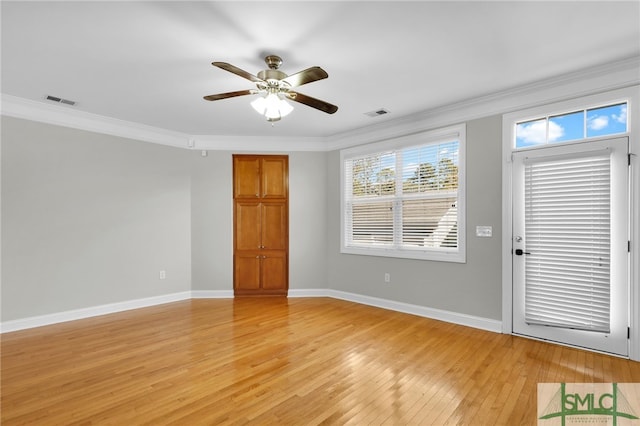 unfurnished room featuring ornamental molding, light hardwood / wood-style floors, and ceiling fan