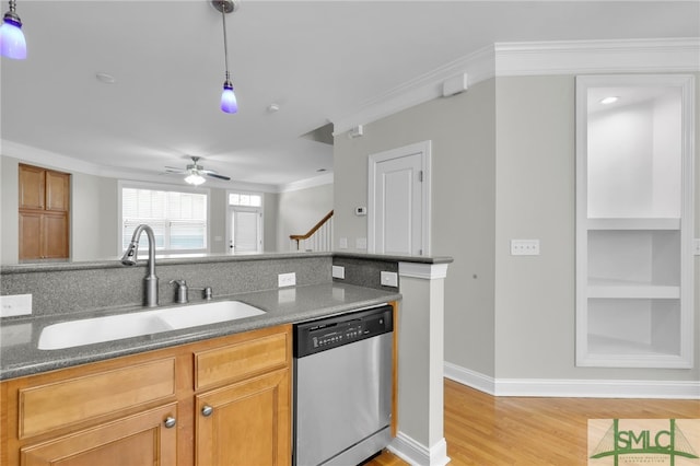 kitchen featuring ceiling fan, light wood-type flooring, dishwasher, decorative light fixtures, and sink