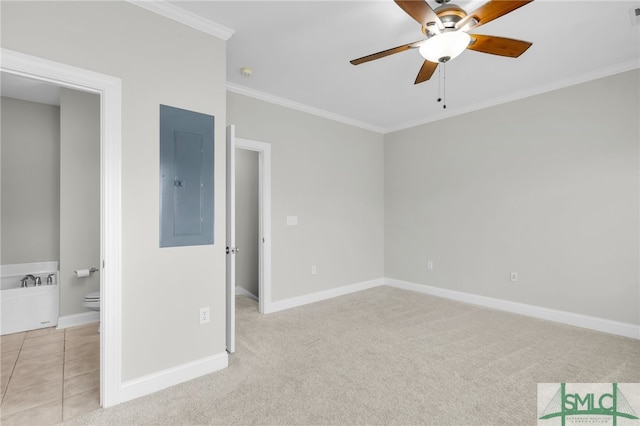 unfurnished bedroom with electric panel, light carpet, crown molding, and ceiling fan