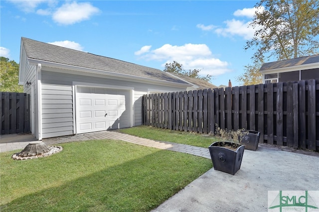 view of yard featuring a garage