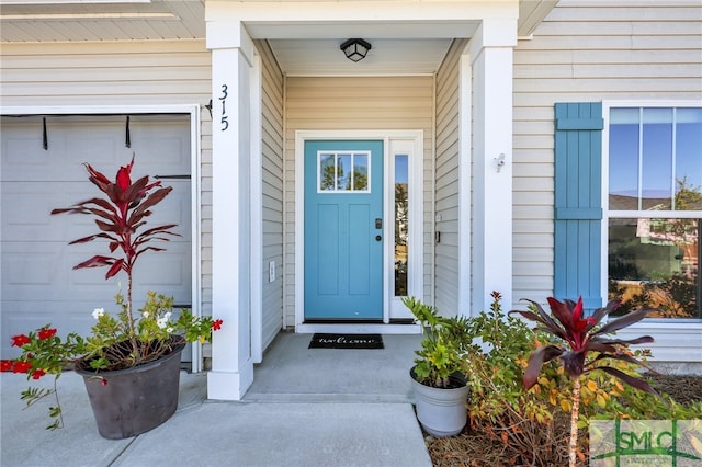 property entrance with a garage