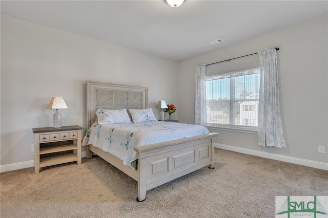 bedroom featuring light carpet