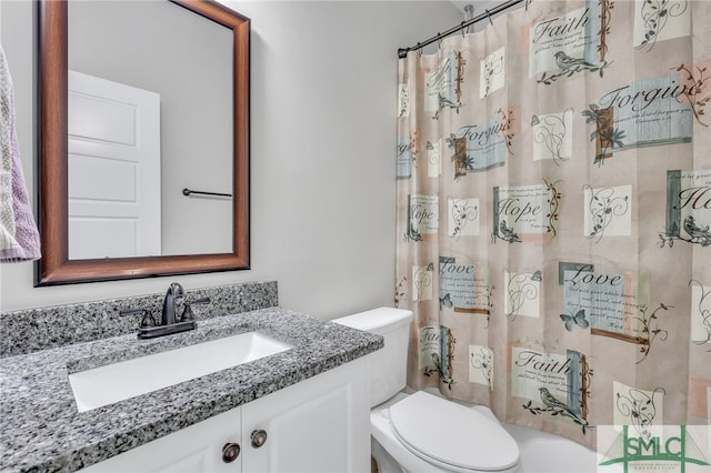 full bathroom featuring vanity, shower / bath combination with curtain, and toilet