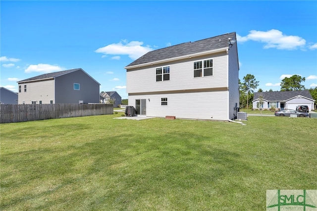 back of house with a patio, a yard, and central AC unit