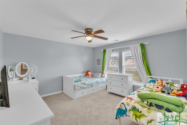 bedroom featuring ceiling fan and light carpet