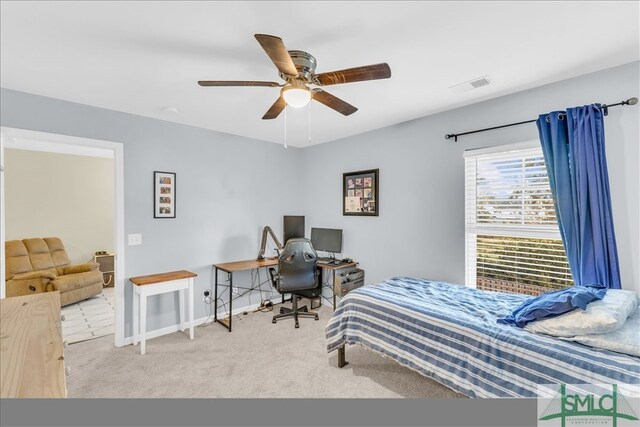 carpeted bedroom with ceiling fan