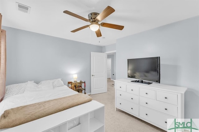 bedroom featuring light carpet and ceiling fan