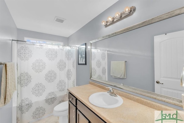 full bathroom with vanity, toilet, and shower / tub combo