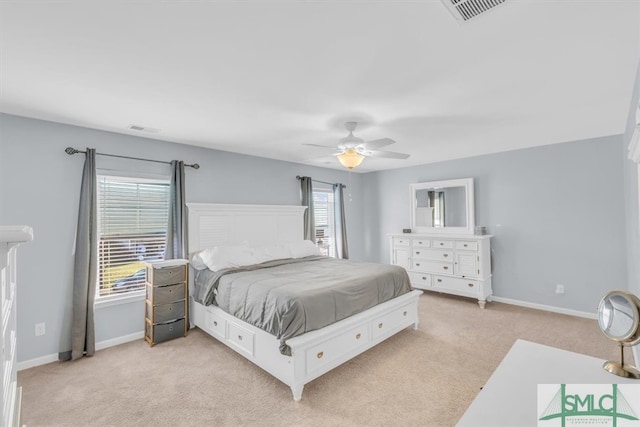 bedroom featuring light carpet and ceiling fan