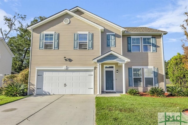 view of front of house featuring a front yard and a garage