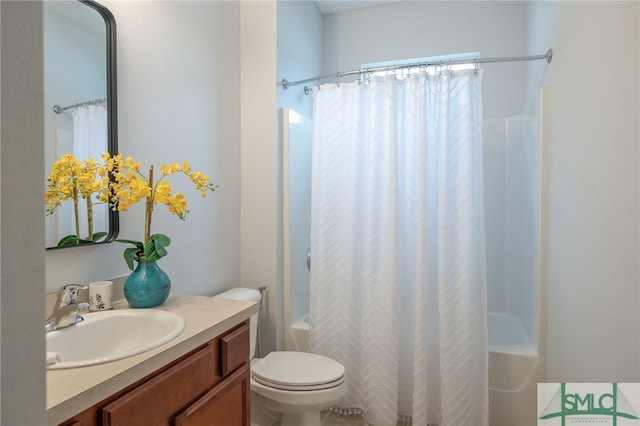 bathroom featuring toilet, shower / bath combo, and vanity