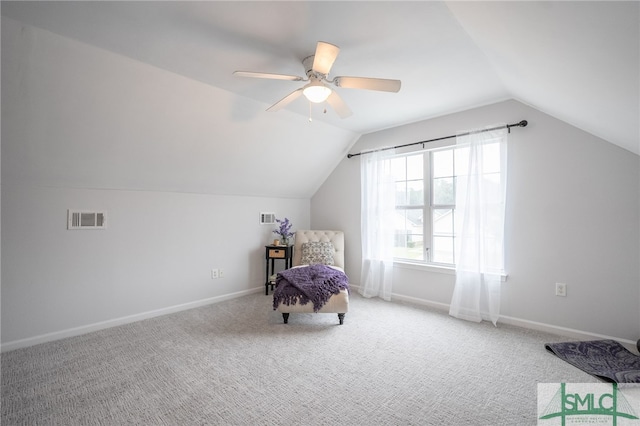 unfurnished room featuring vaulted ceiling, carpet flooring, and ceiling fan